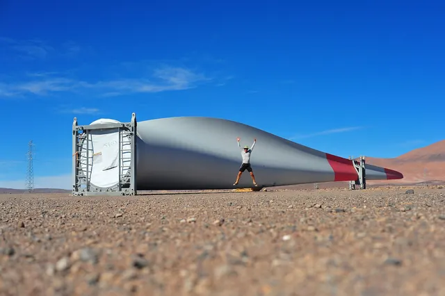 A turbine blade on a transport frame in the desert