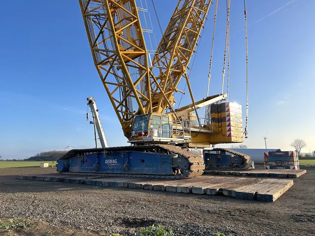 A crawler crane on a wind turbine construction site