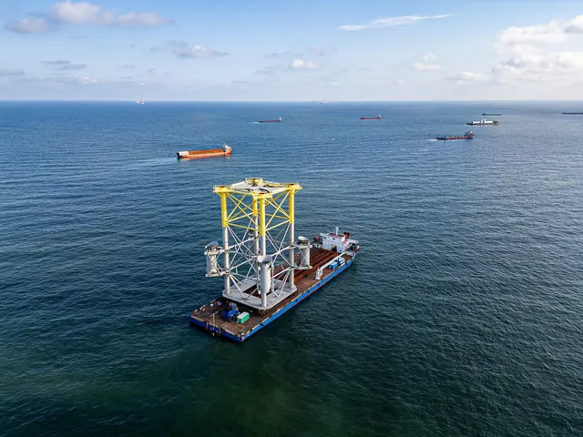 An installation vessel at sea with other ships nearby