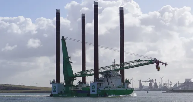 A jack-up crane ship sailing with its legs raised