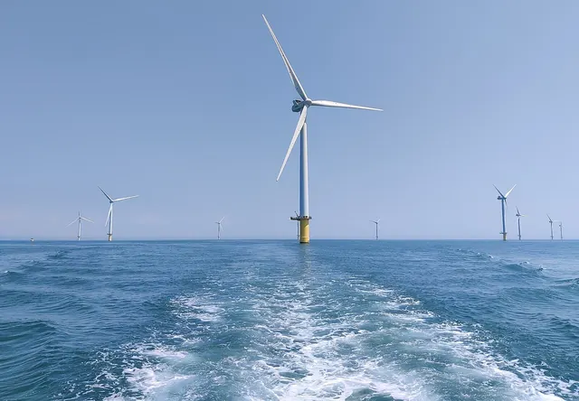 An offshore wind turbine seen from the wake of a boat